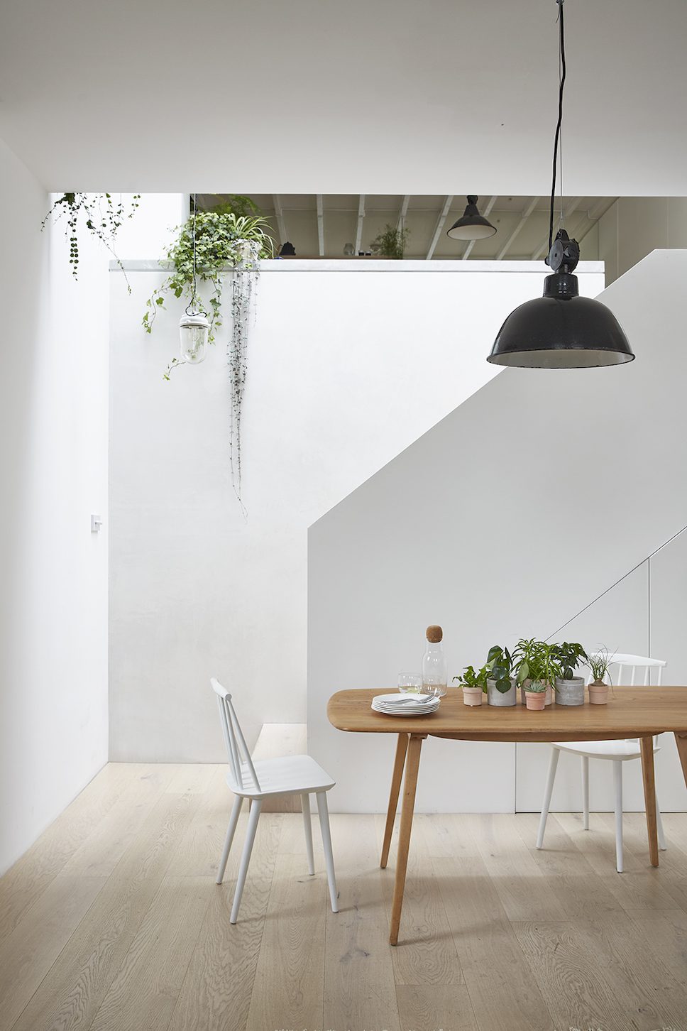 The kitchen bespoke designed by HUTCH looks down into the living space