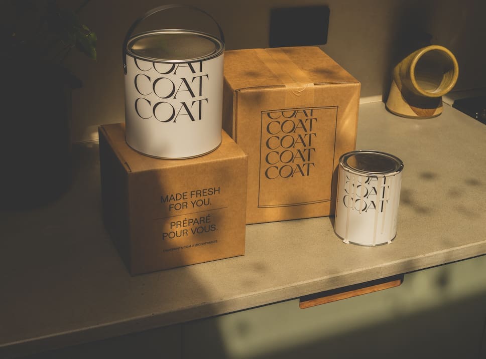COAT Paints packaging and paint pots
